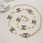 Chanel chain belt on display, gold and dark blue enamel links with CC connector