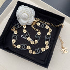 Chanel chain belt in box; gold and dark blue links with round medallion accents