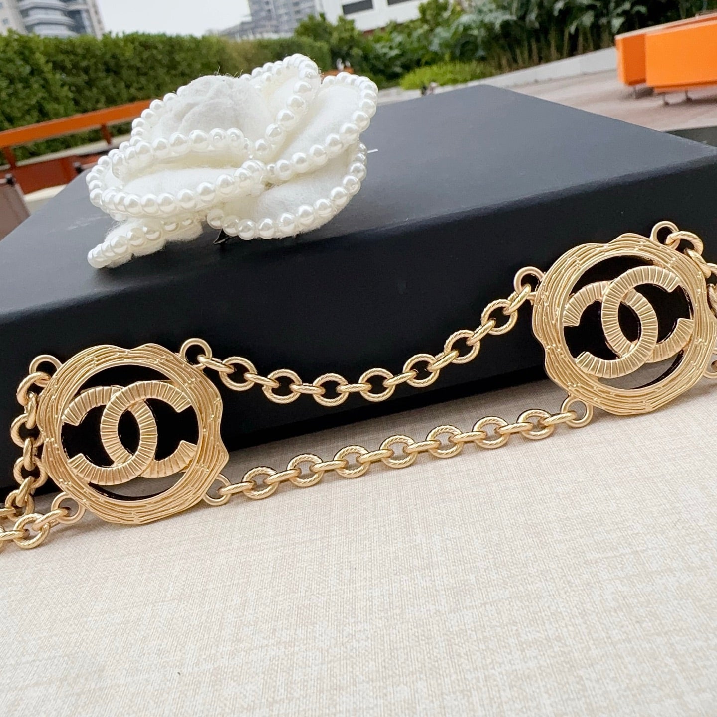 Gold-tone chain belt with two large round interlocking CC medallion charms
