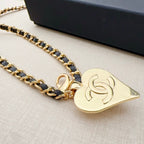 Chanel belt with gold-tone chain links and heart-shaped charm pendant