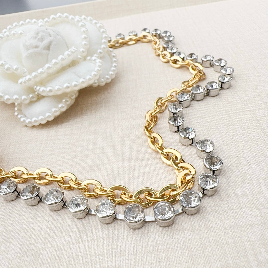 Gold and rhinestone belt with alternating crystal links and layered chain sections