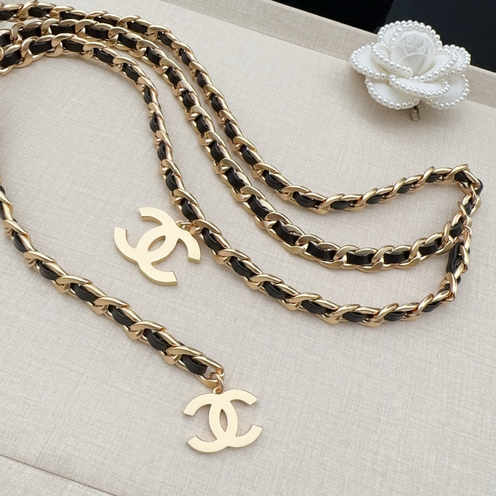 Chanel belt with gold-and-black chain links and gold CC drop charms