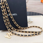 Chanel belt strap with gold-and-black chain links and gold CC charm