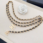 Chanel belt with gold-and-black chain links and gold CC charms