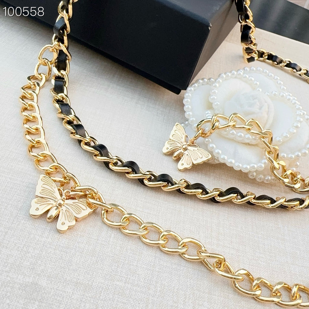 Chanel belt with gold-tone chain and black links, featuring butterfly charms