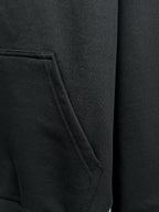 Balenciaga black hoodie pocket close-up with stitched seam detail