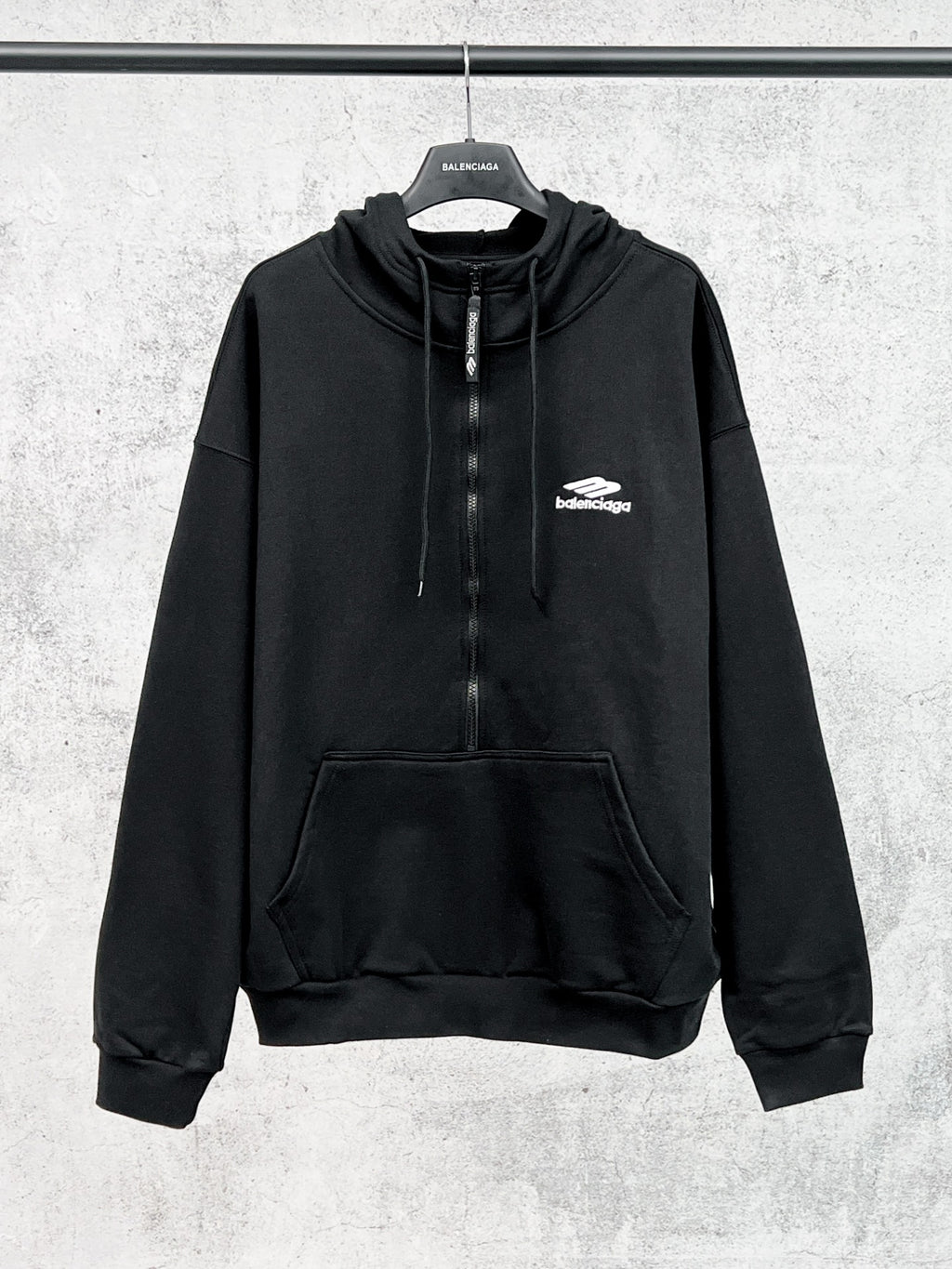 Balenciaga black long-sleeve pullover hoodie with drawstring and front pocket