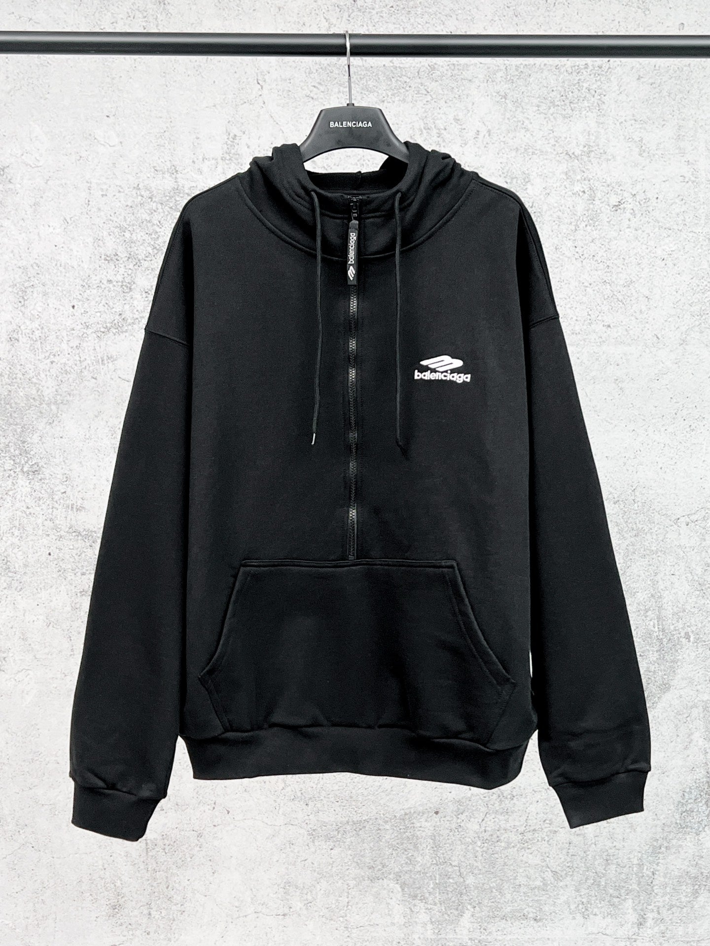 Balenciaga black long-sleeve pullover hoodie with drawstring and front pocket