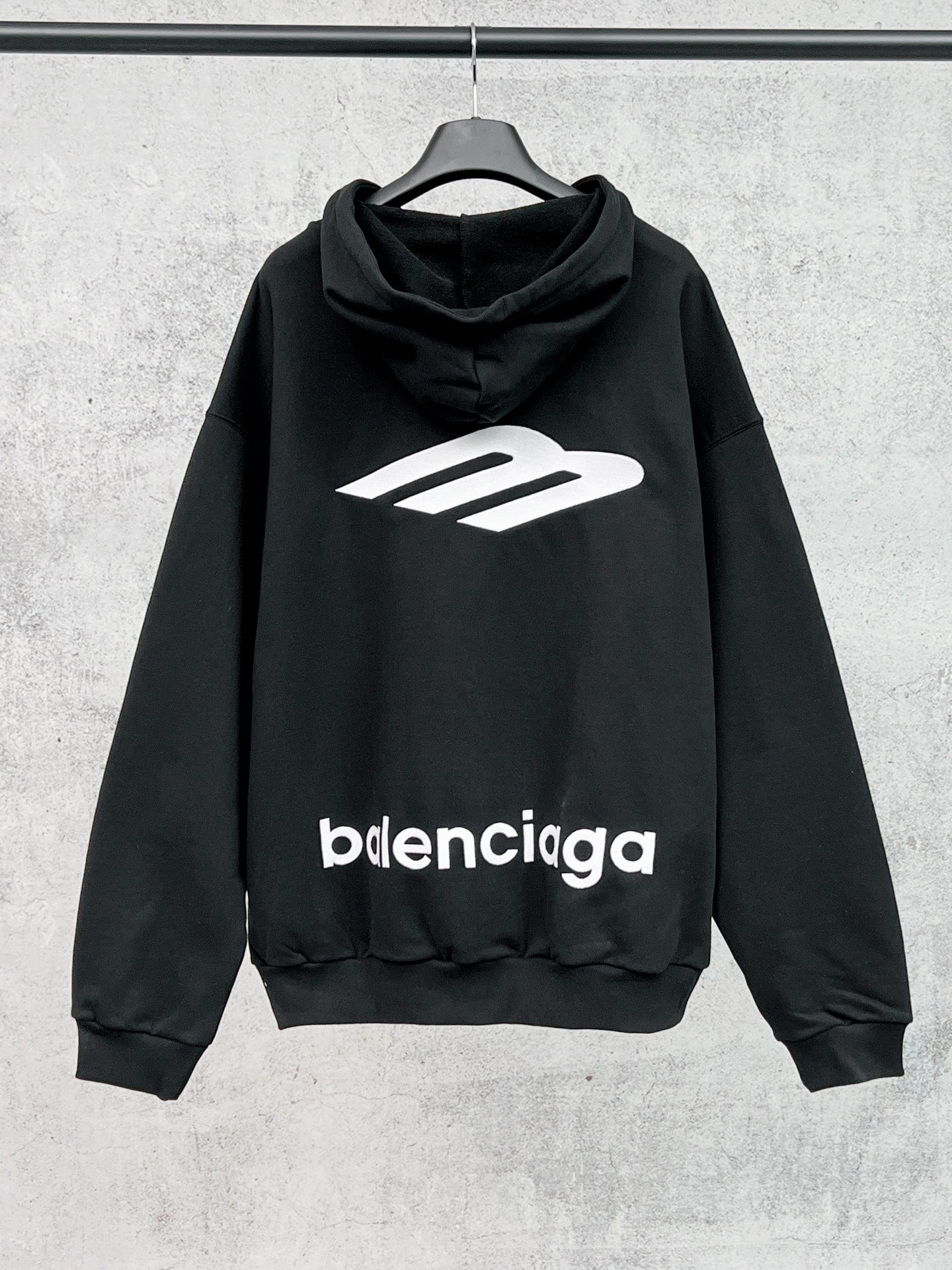 Balenciaga black hoodie with large back graphic, front logo print, and drawstring