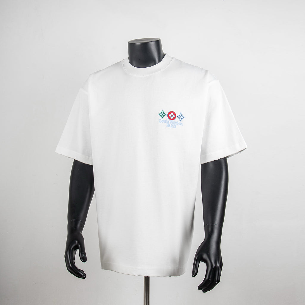 White short-sleeve T-shirt with small multicolor logo graphic on the chest