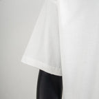 White short-sleeve T-shirt side view with straight hem and visible stitching