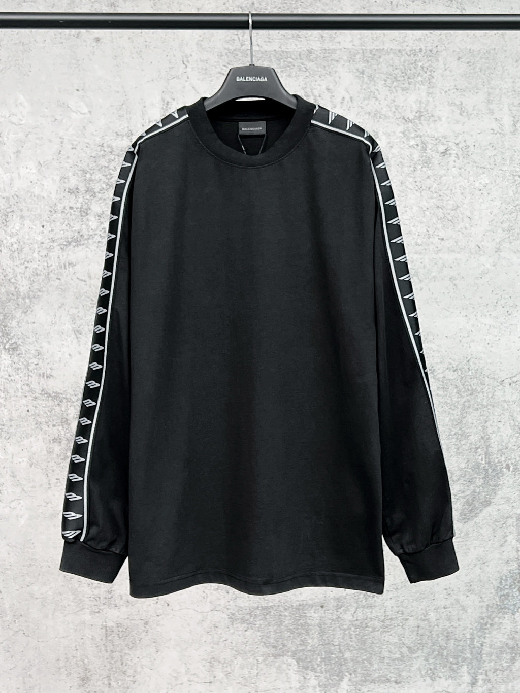 Long-sleeve black shirt with white Balenciaga logo stripe sleeves