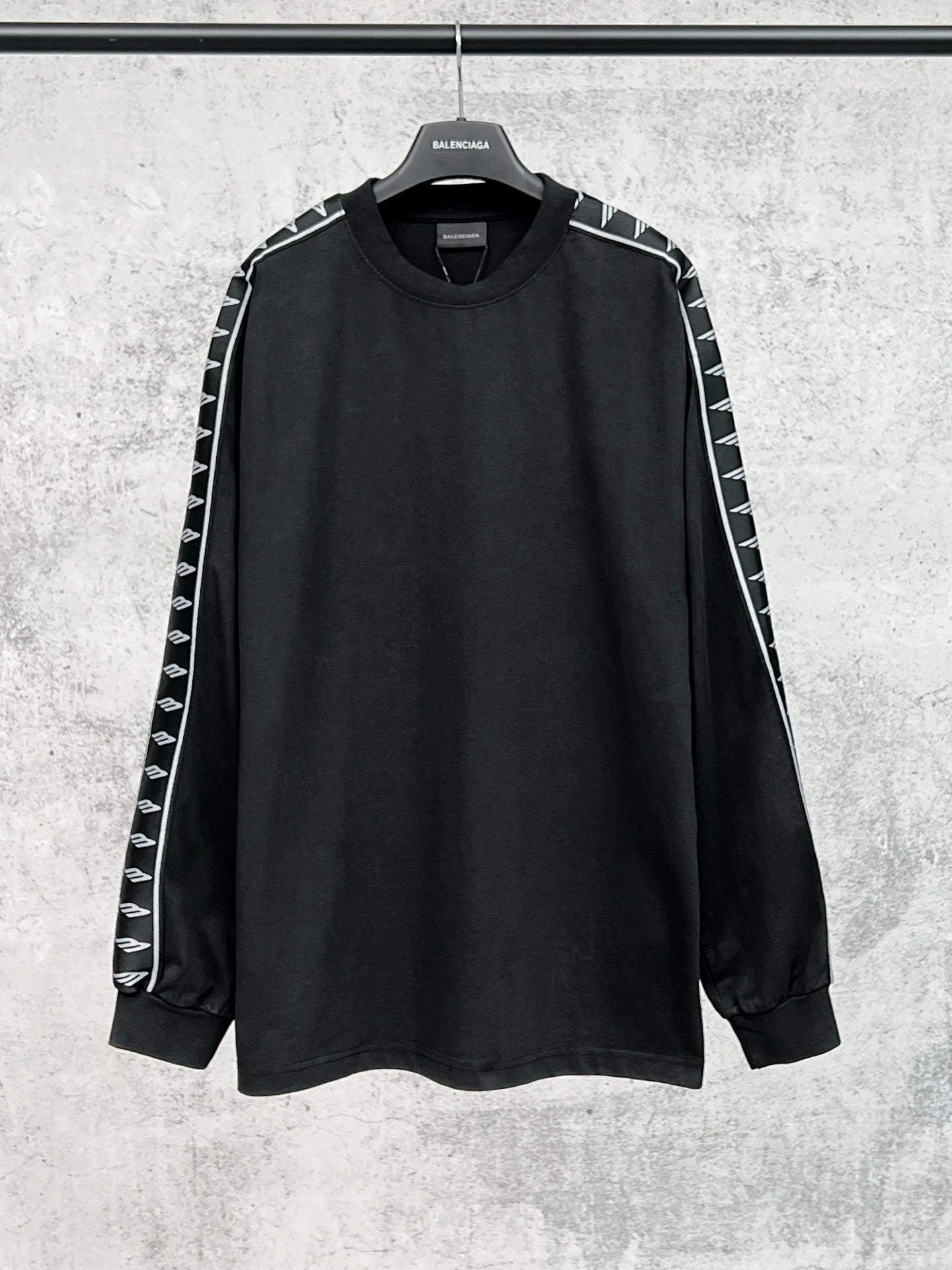Long-sleeve black shirt with white Balenciaga logo stripe sleeves
