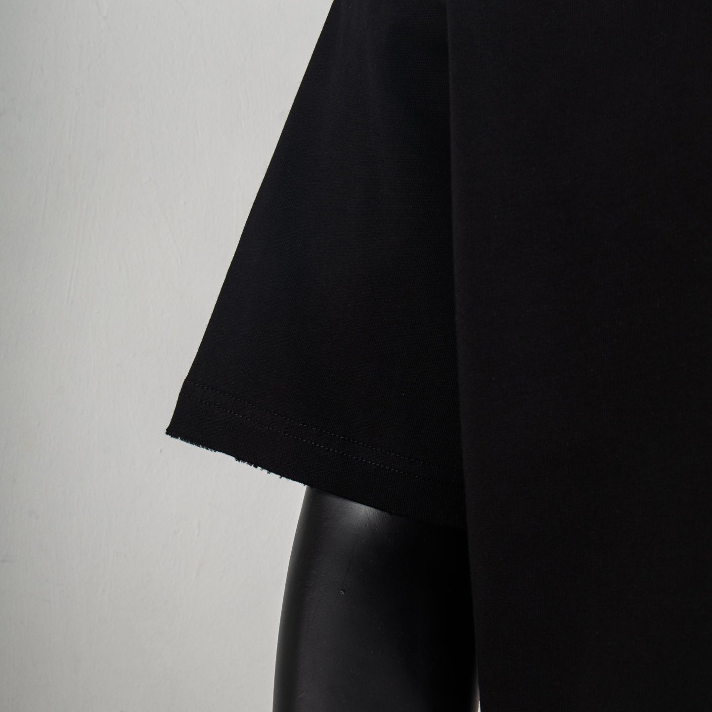 Louis Vuitton black T-shirt side view with straight hem