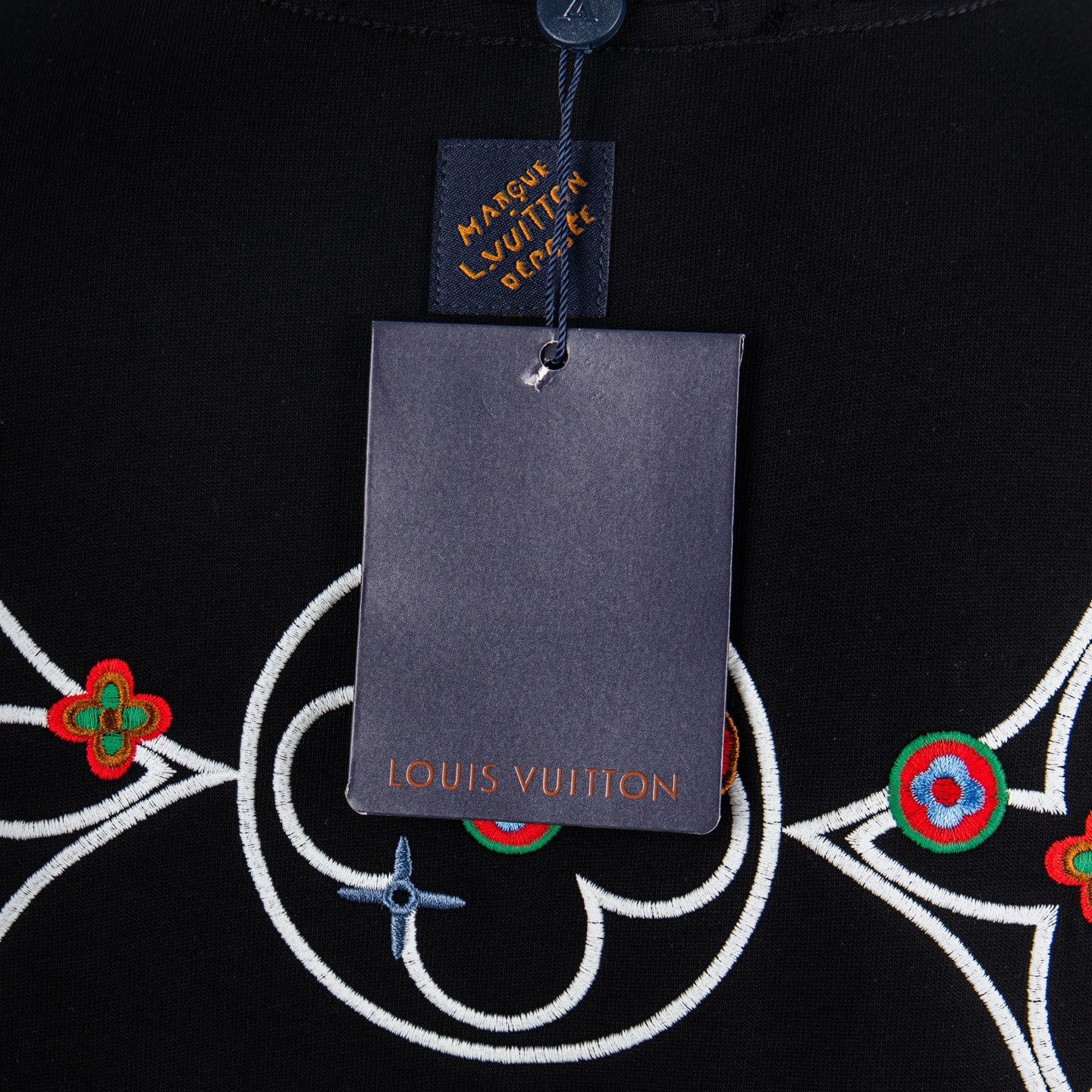 Louis Vuitton T-shirt neck label and hanging tag close-up