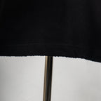 Louis Vuitton black T-shirt lower hem seam detail