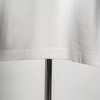 White T-shirt hem and stitching detail