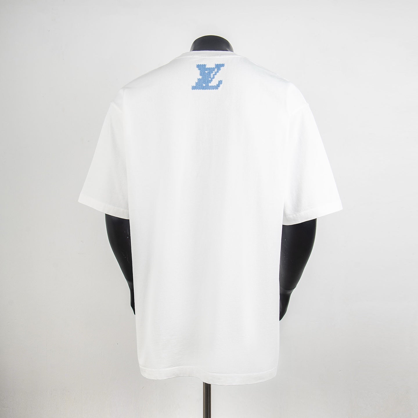 Louis Vuitton T-shirt in white with blue LV logo on back