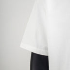 Louis Vuitton white short-sleeve T-shirt hem and drape, side view.