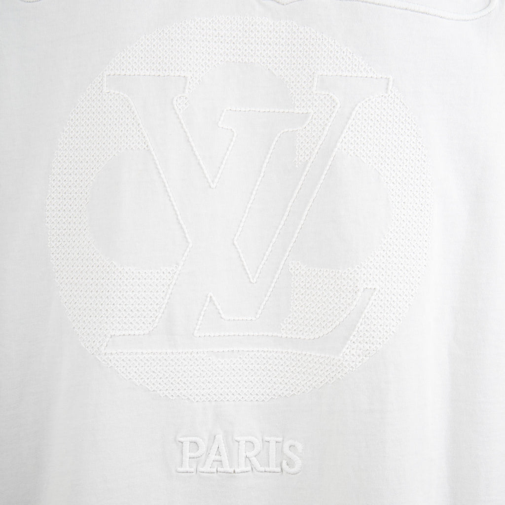 Louis Vuitton white T-shirt with tonal LV monogram and 'PARIS' lettering.