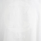 Louis Vuitton white T-shirt with tonal LV monogram and 'PARIS' lettering.