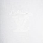 White T-shirt with faint LV-style monogram emblem