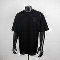 Black short-sleeve T-shirt with Louis Vuitton monogram on left chest.