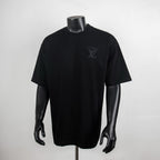 Black short-sleeve T-shirt with Louis Vuitton monogram on left chest.
