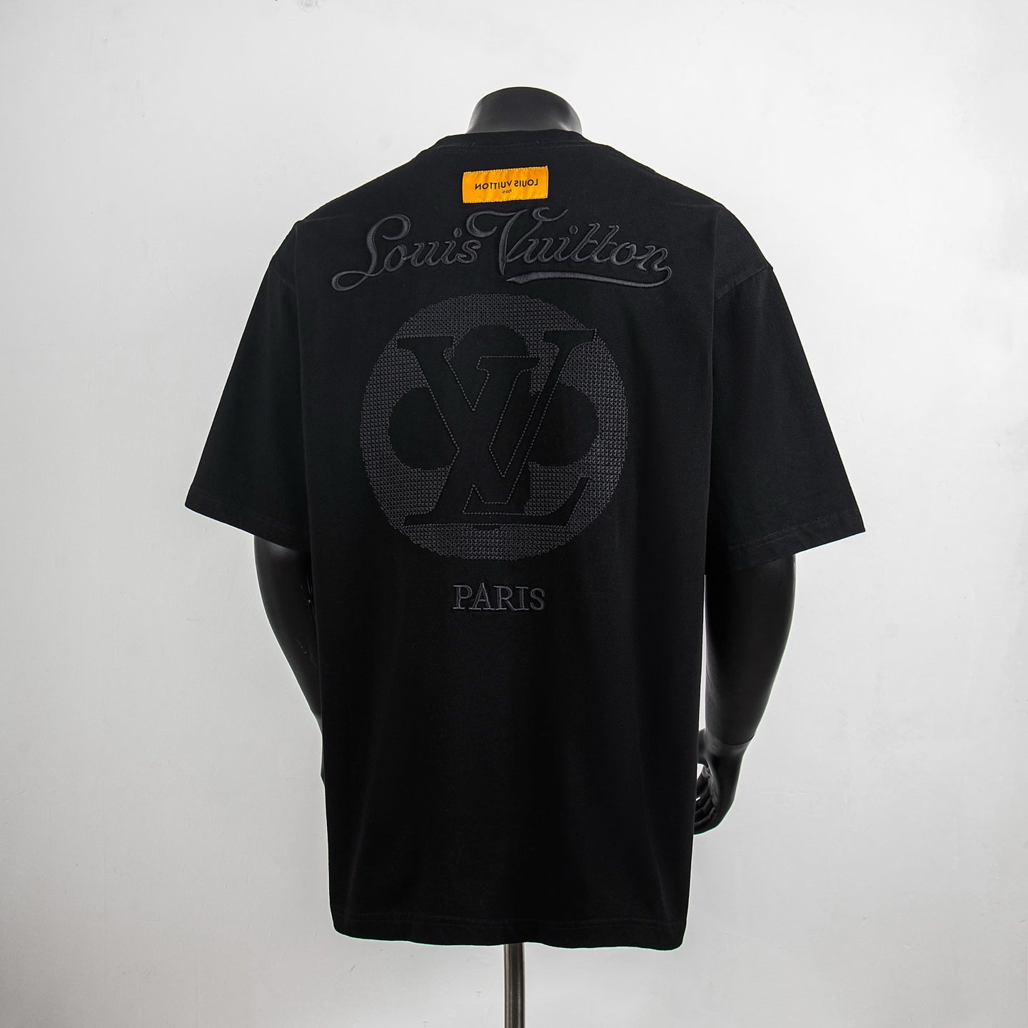 Black short-sleeve T-shirt with Louis Vuitton back graphic and PARIS text.