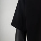 Black short-sleeve T-shirt side view showing hem and sleeve.