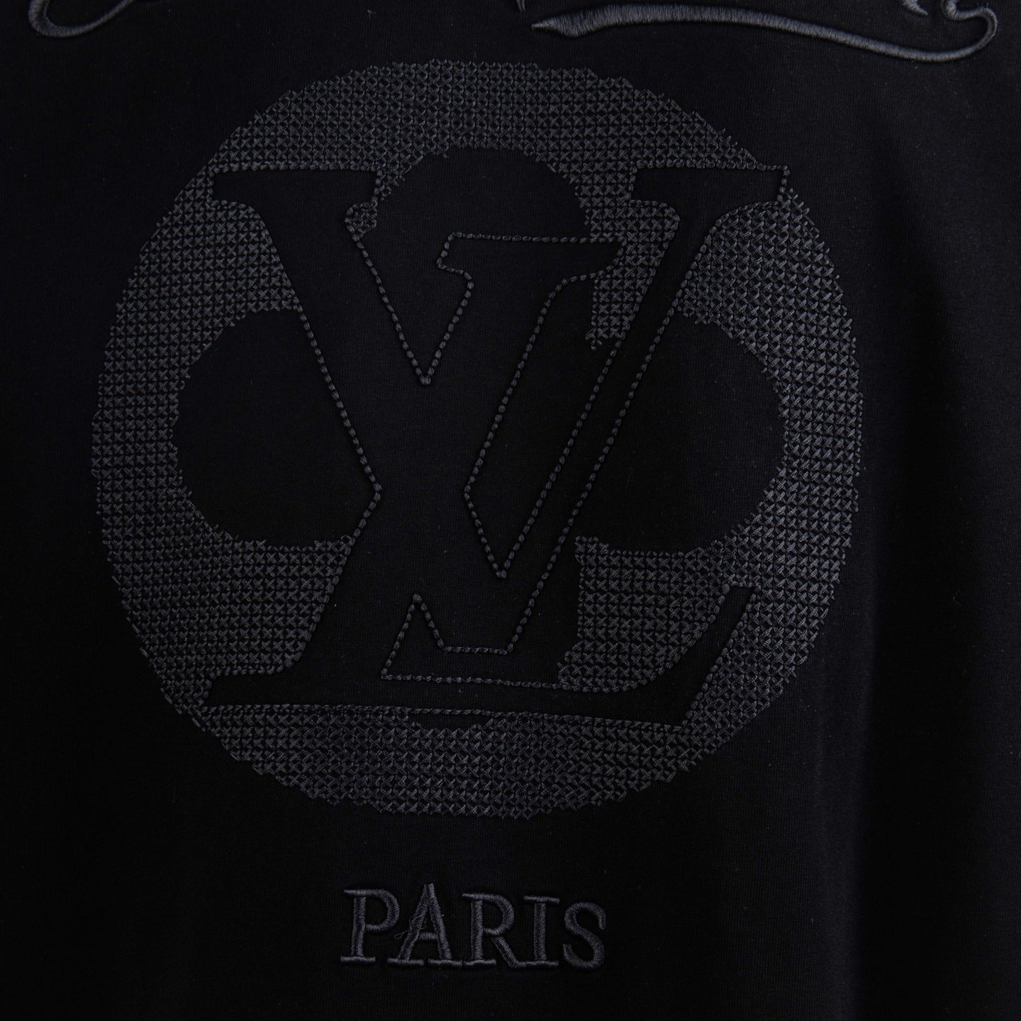 Black T-shirt back graphic with large LV emblem and PARIS text.