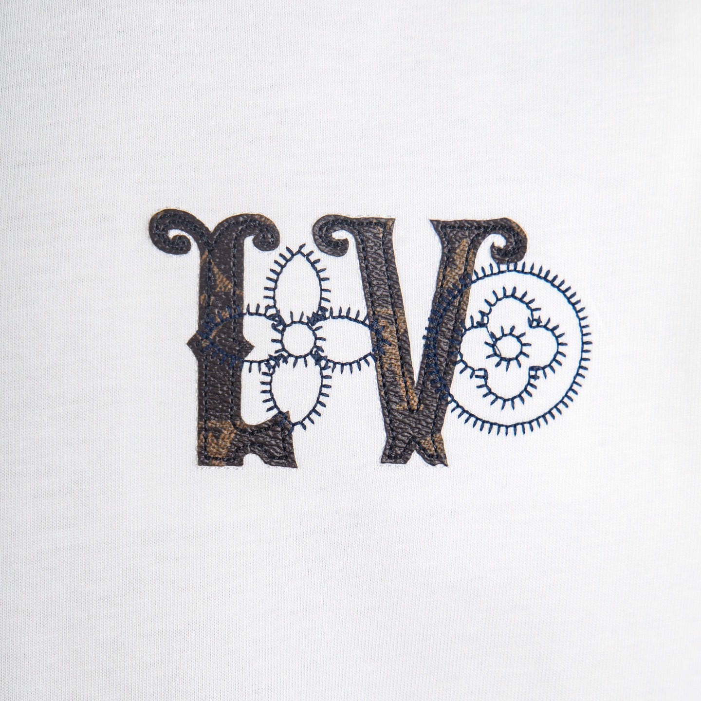 White T-shirt with black embroidered-style 'LV' logo graphic