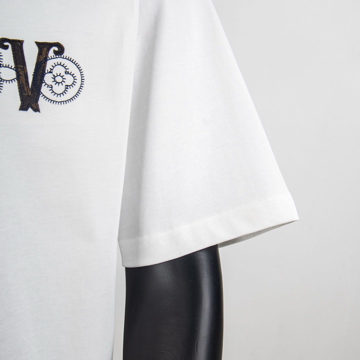 Louis Vuitton white T-shirt sleeve and hem with partial front logo