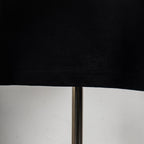 Black T-shirt hem and bottom seam, short sleeve edge view