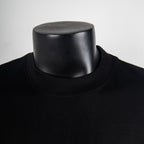 Black crewneck T-shirt collar close-up with ribbed neckline