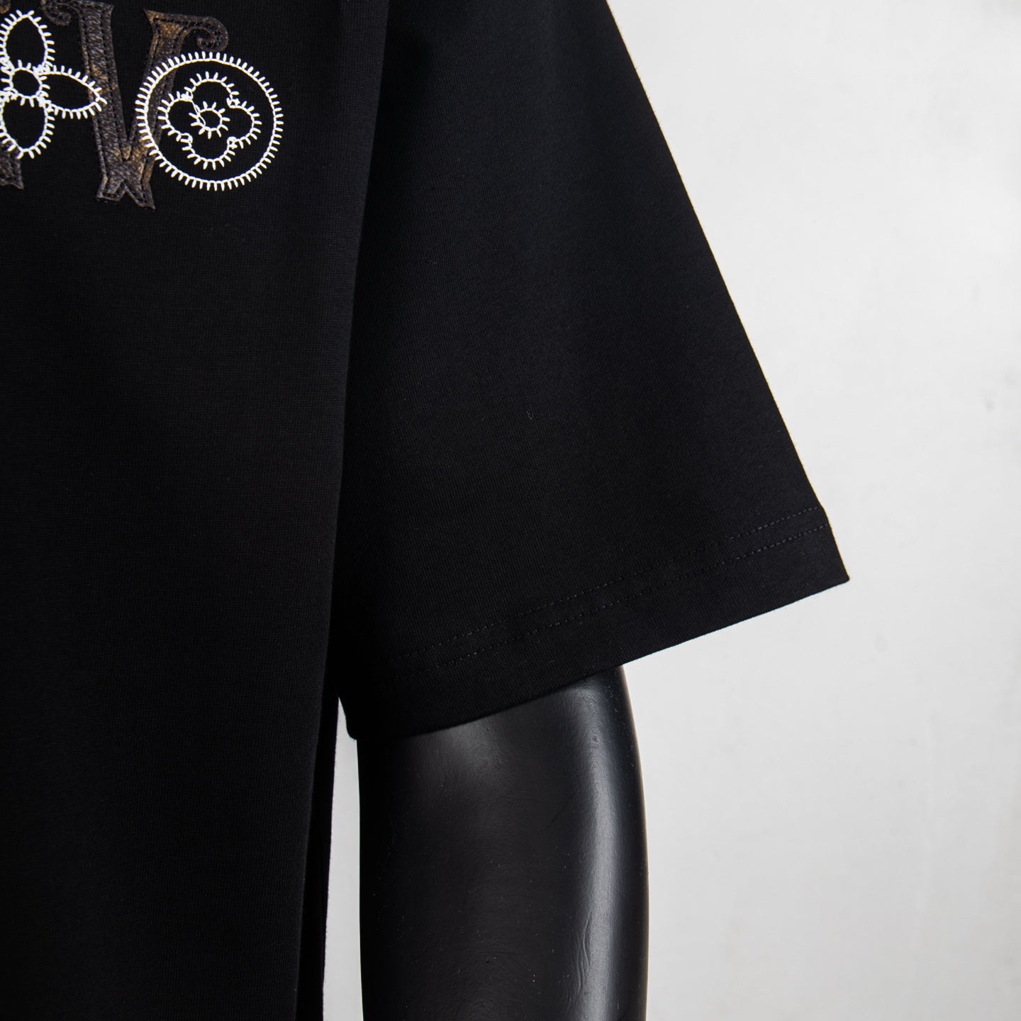 Black T-shirt sleeve and side seam