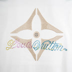 White T-shirt star-shaped rhinestone graphic with central snap detail.
