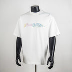 White crew-neck T-shirt with multicolor rhinestone front logo, short sleeves.