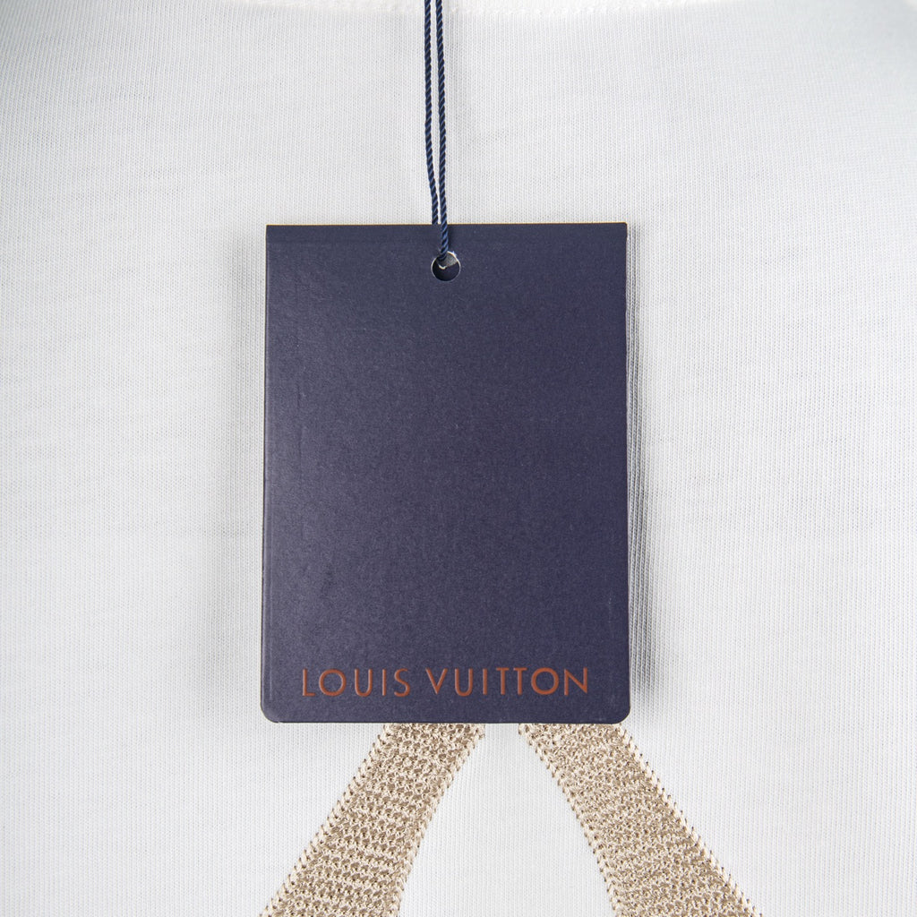 Louis Vuitton hang tag attached to white T-shirt collar.