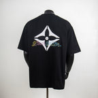 Black T-shirt with large rhinestone star logo on back