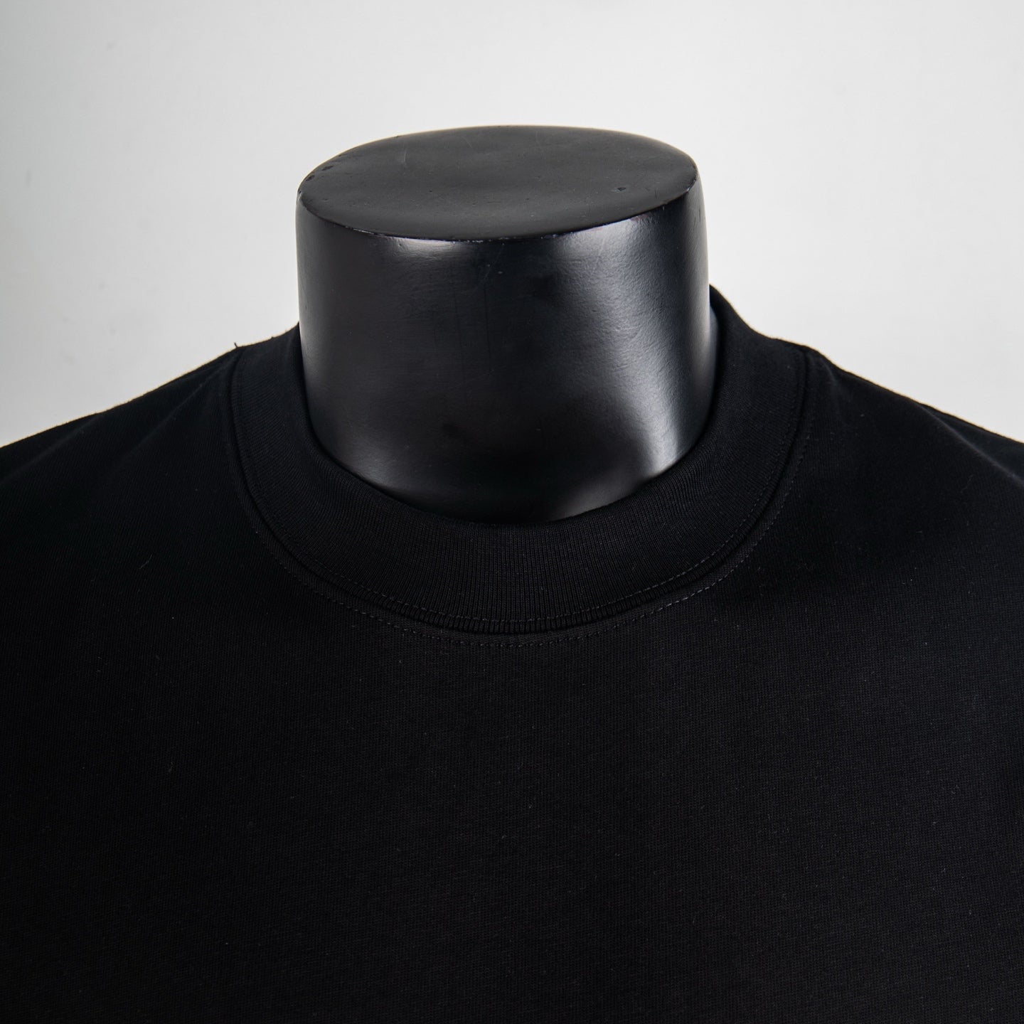 Black T-shirt crew neck collar close-up