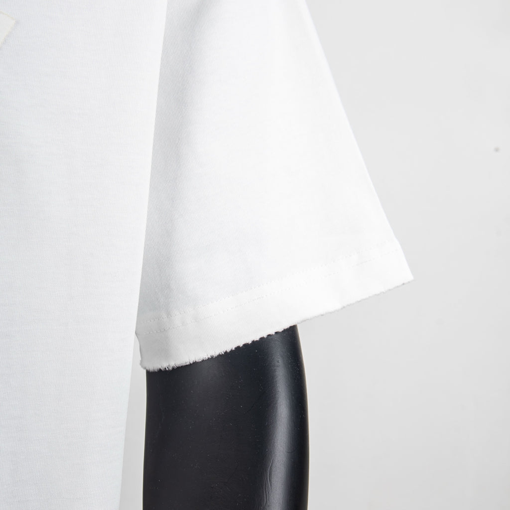White T-shirt side view with draped fabric and curved hemline