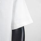 White T-shirt side view with draped fabric and curved hemline