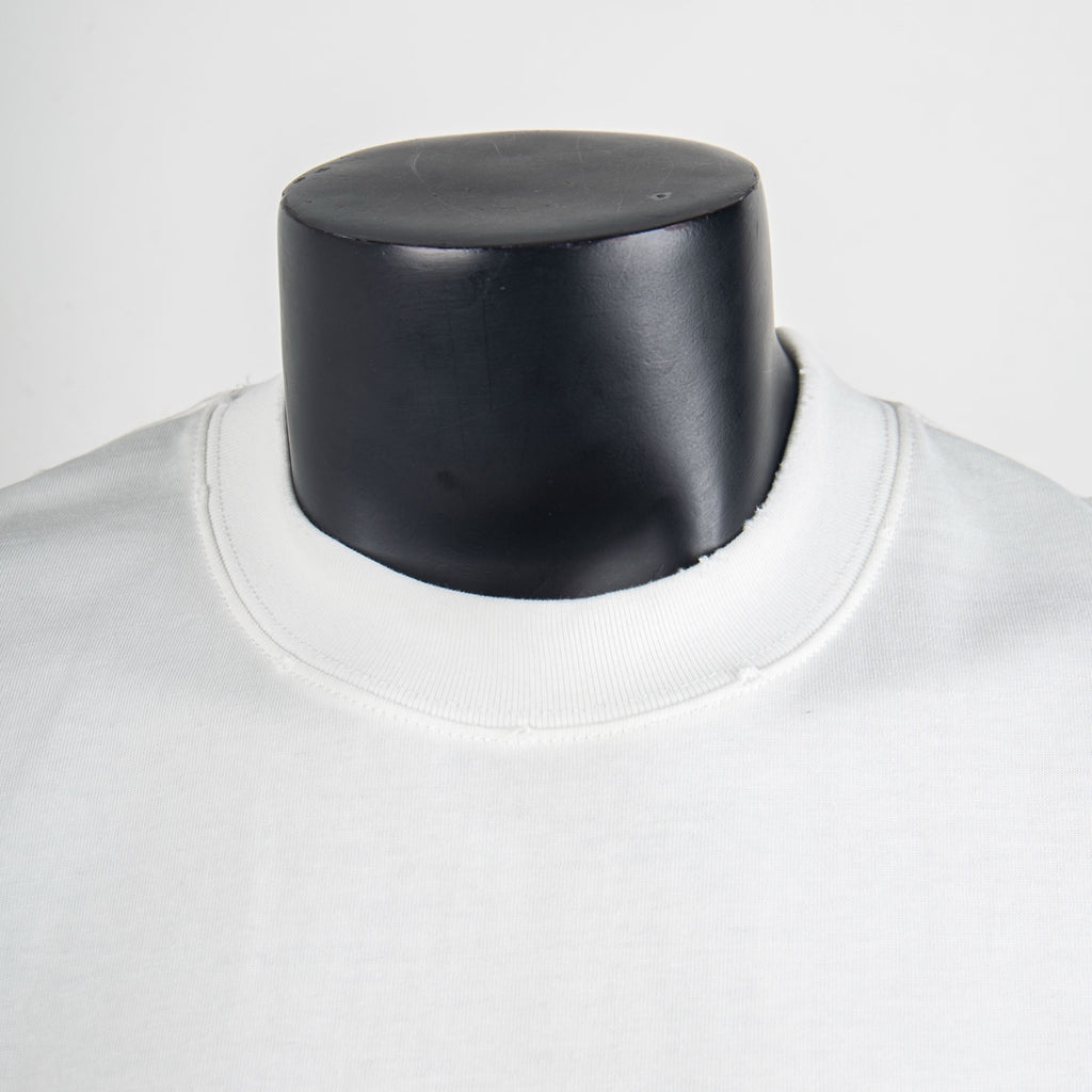 White crewneck T-shirt collar close-up with smooth neckline seam
