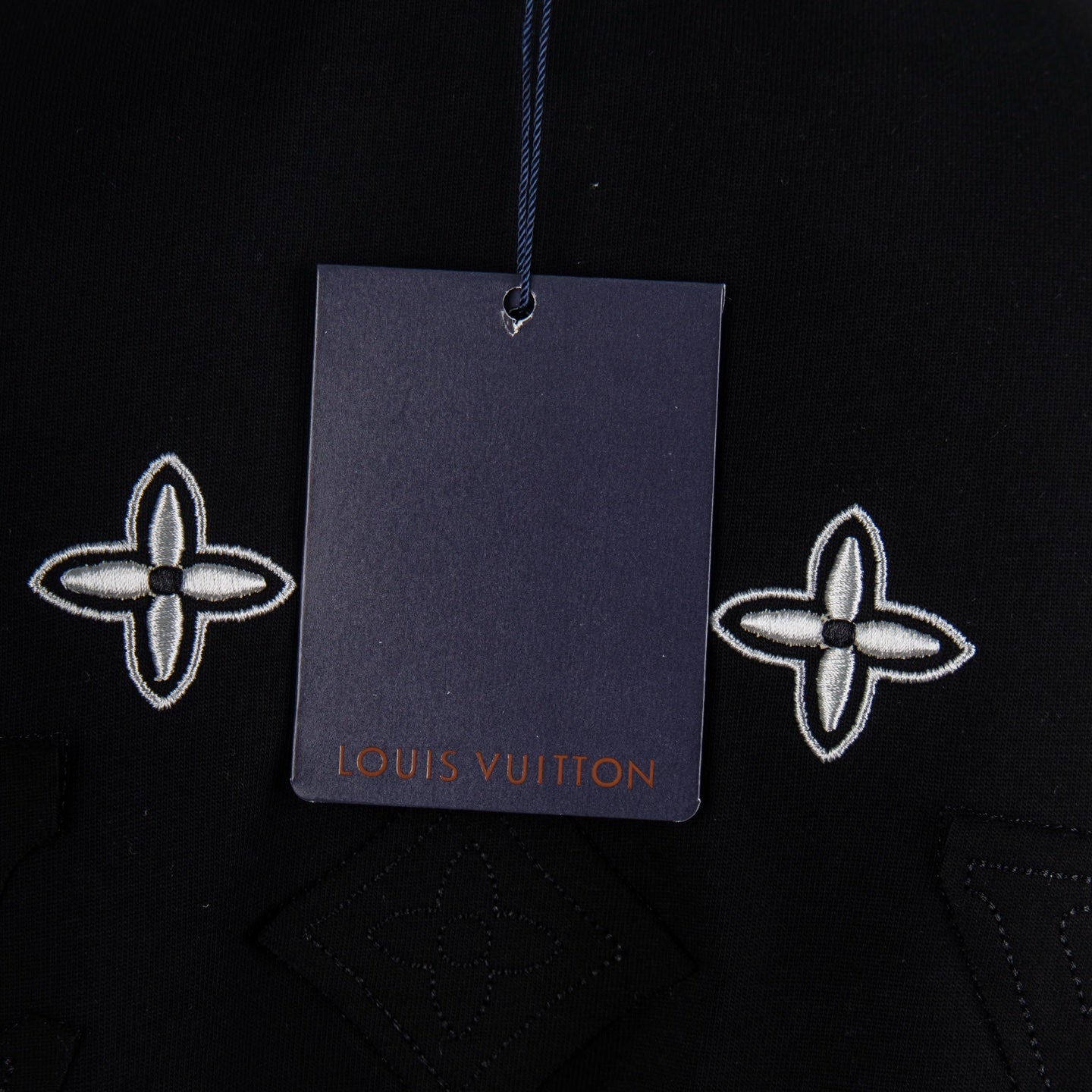Black crew-neck short-sleeve T-shirt with hanging price tag