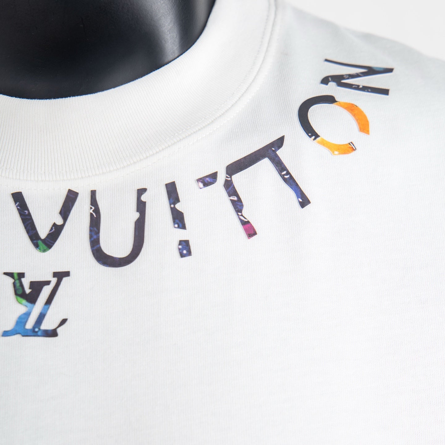 Louis Vuitton white T-shirt crew neck with multicolor logo text print detail.