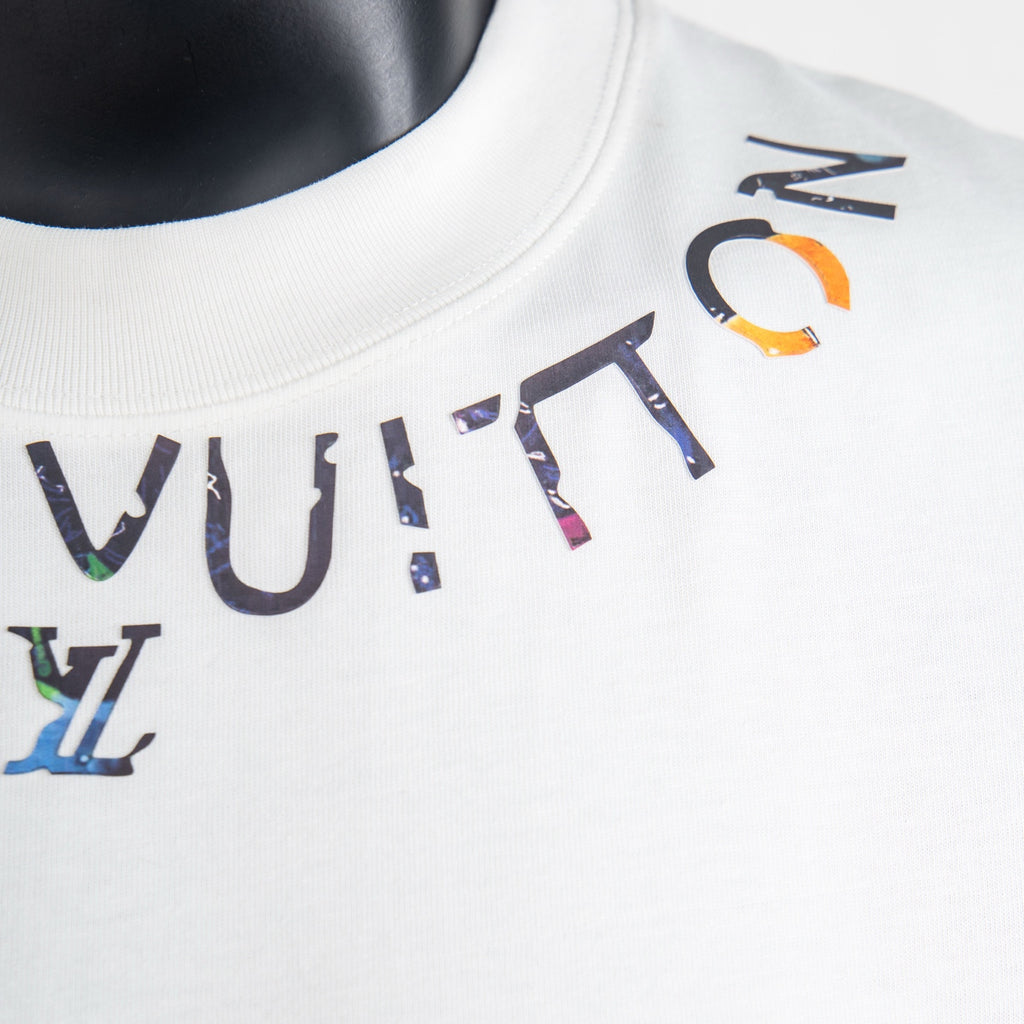 White Louis Vuitton T-shirt close-up of colorful logo graphic around the neckline
