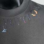 Dark gray short-sleeve T-shirt showing crew neck seam and colorful logo embroidery