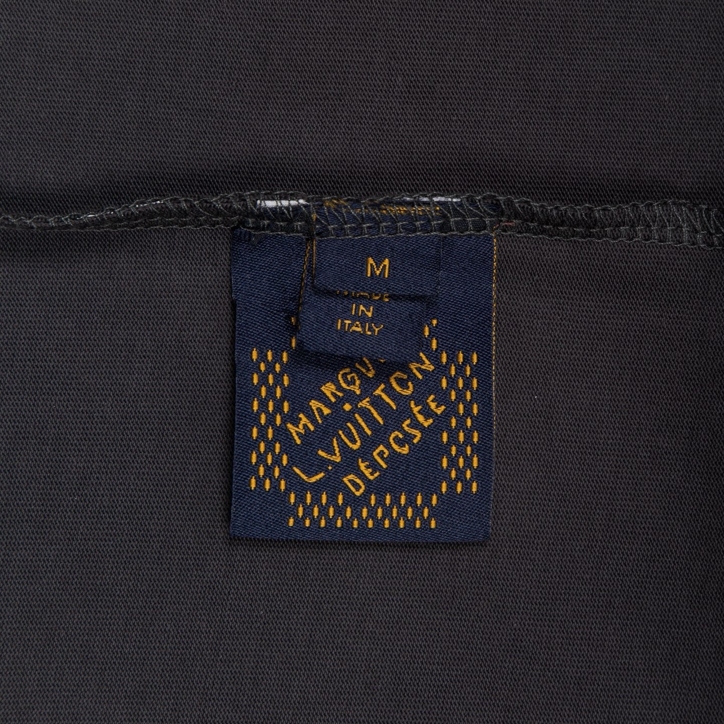 Louis Vuitton size and country label on dark gray T-shirt, “M”, “Italy”