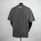 Short-sleeve T-shirt back view in dark gray with neck label at center